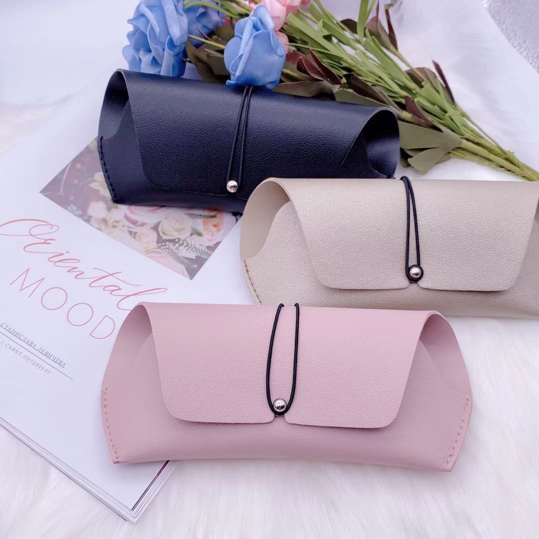 Stylish PU sunglasses storage box in black, beige, and pink, perfect for organizing eyewear and adding elegance to your space.
