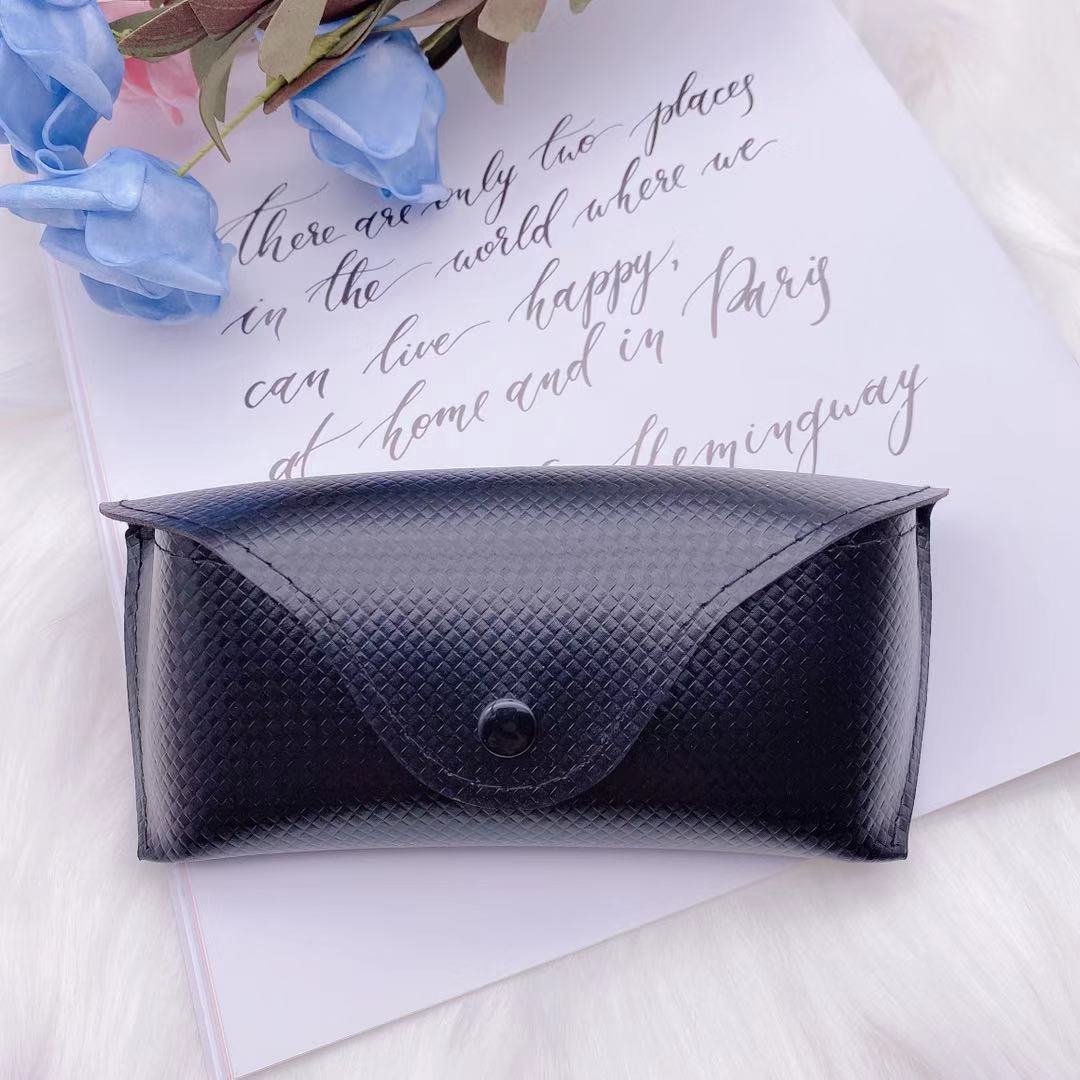 Stylish black PU sunglasses box storage on a decorative background with flowers and elegant text.