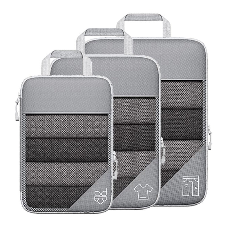 Travel compressible storage bag set in gray with mesh design, ideal for organizing clothes and accessories during travel.