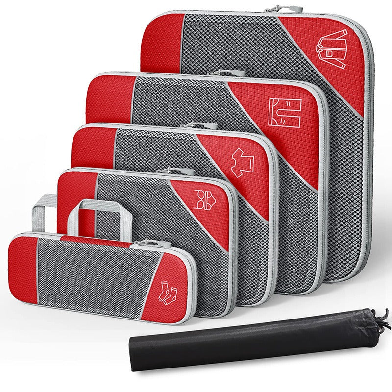 Travel compressible storage bag set in red and gray, featuring multiple compartments for organizing clothing and accessories.