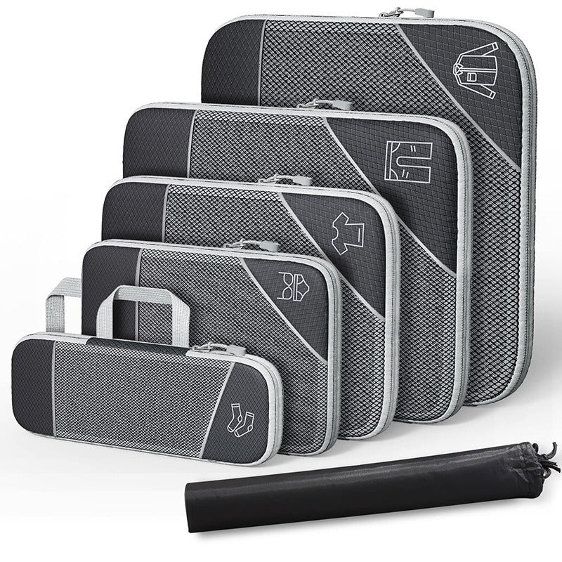 Set of compressible travel storage bags in black and gray, perfect for organizing shoes, clothing, and personal items.