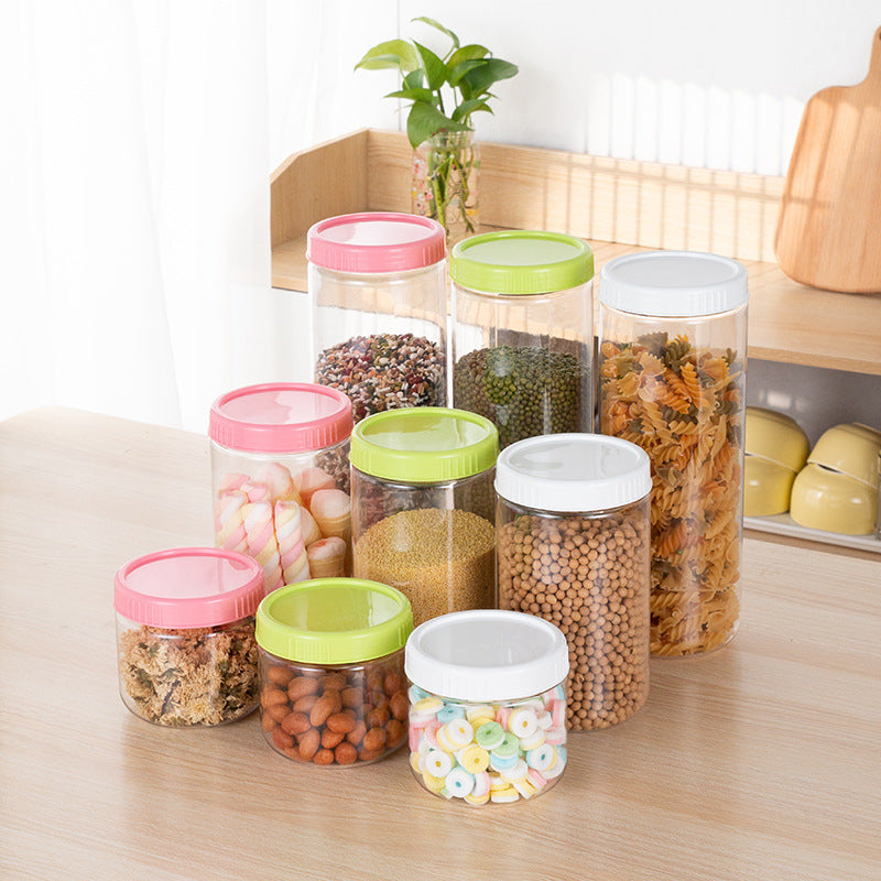 Modern minimalist round grain storage boxes in white, pink, and green, displayed on a kitchen countertop, perfect for organizing.